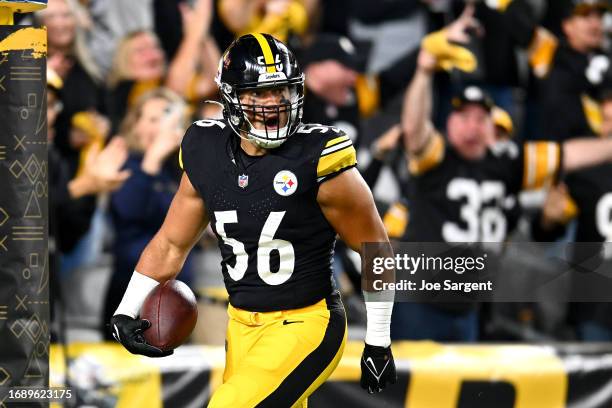 Alex Highsmith of the Pittsburgh Steelers celebrate after scoring a touchdown on an interception against the Cleveland Browns during the first...