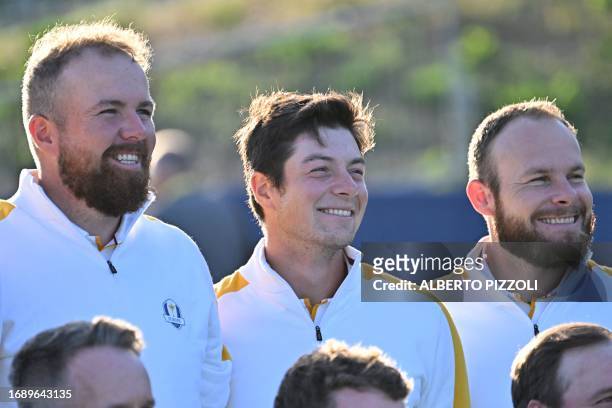Europe's Irish golfer, Shane Lowry, Europe's Norwegian golfer, Viktor Hovland and Europe's English golfer, Tyrrell Hatton smile as they pose during...