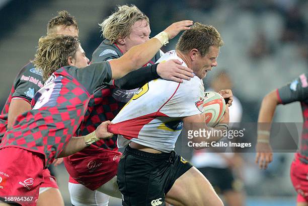 Deon van Rensburg of the Lions gets tackled during the Vodacom Cup Final match between Steval Pumas and MTN Golden Lions at Mbombela Stadium on May...