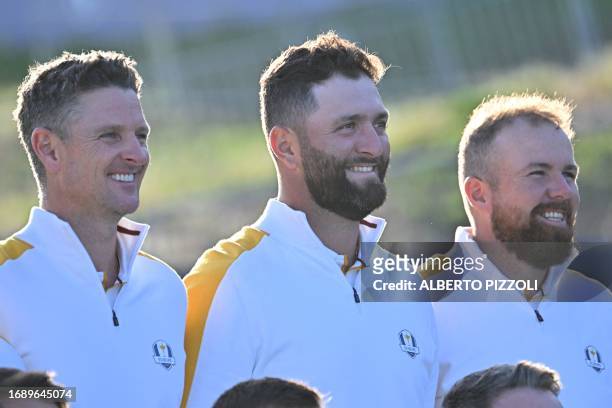 Europe's English golfer, Justin Rose, Europe's Spanish golfer, Jon Rahm and Europe's Irish golfer, Shane Lowry smile as they pose during the European...