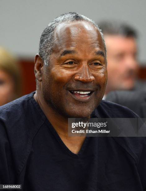 Simpson smiles during an evidentiary hearing in Clark County District Court on May 17, 2013 in Las Vegas, Nevada. Simpson, who is currently serving a...