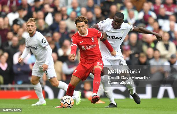 Liverpool's Curtis Jones battles with West Ham United's Kurt Zouma during the Premier League match between Liverpool FC and West Ham United at...