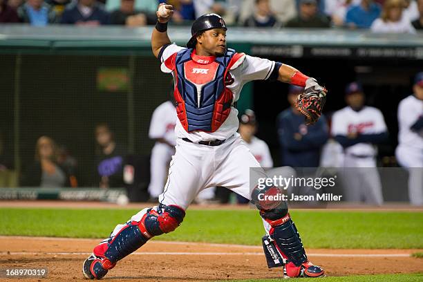 Catcher Carlos Santana of the Cleveland Indians throws to second base during the seventh inning against the Seattle Mariners at Progressive Field on...