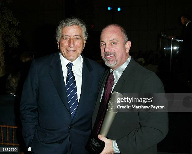 Tony Bennett poses with Billy Joel after presenting him with a lifetime achievement award during the 2002 New York Magazine Awards Luncheon December...