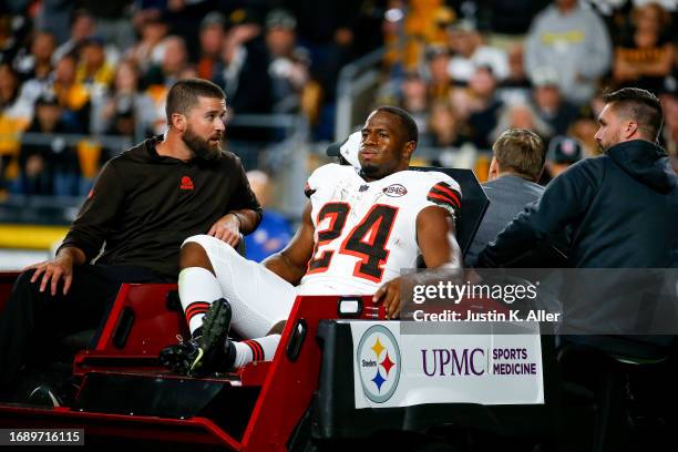 Nick Chubb of the Cleveland Browns is carted off the field after sustaining a knee injury during the second quarter against the Pittsburgh Steelers...