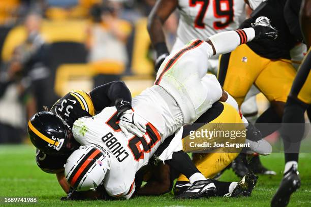 Nick Chubb of the Cleveland Browns is injured on a tackle by Cole Holcomb of the Pittsburgh Steelers during the second quarter at Acrisure Stadium on...