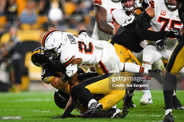 Nick Chubb of the Cleveland Browns is injured on a tackle by Cole Holcomb of the Pittsburgh Steelers during the second quarter at Acrisure Stadium on...