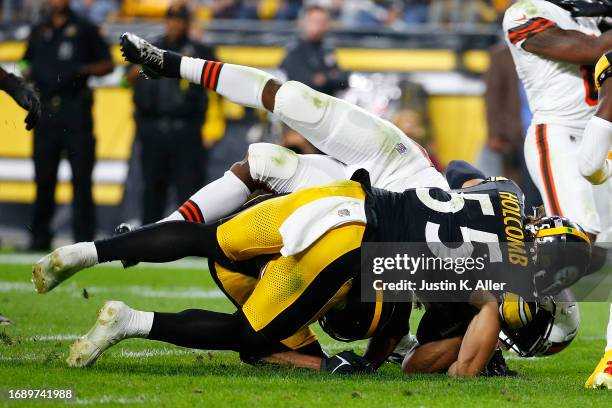 Nick Chubb of the Cleveland Browns is injured on a tackle by Cole Holcomb of the Pittsburgh Steelers during the second quarter at Acrisure Stadium on...