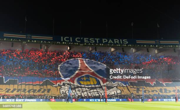 Paris Saint-Germain fans wave flags prior to the Ligue 1 Uber Eats match between Paris Saint-Germain and Olympique de Marseille at Parc des Princes...