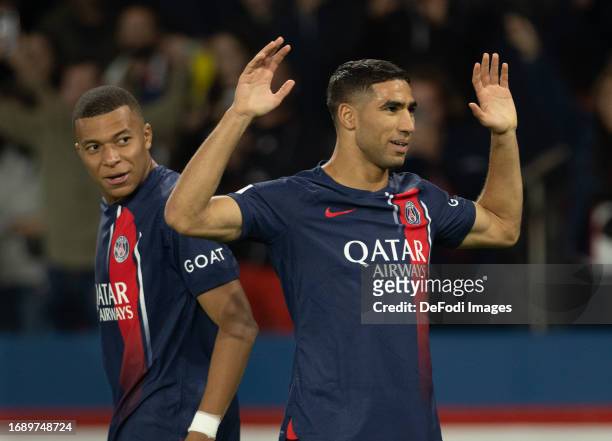 Achraf Hakimi of PSG celebrates after scoring his team's first goal during the Ligue 1 Uber Eats match between Paris Saint-Germain and Olympique de...