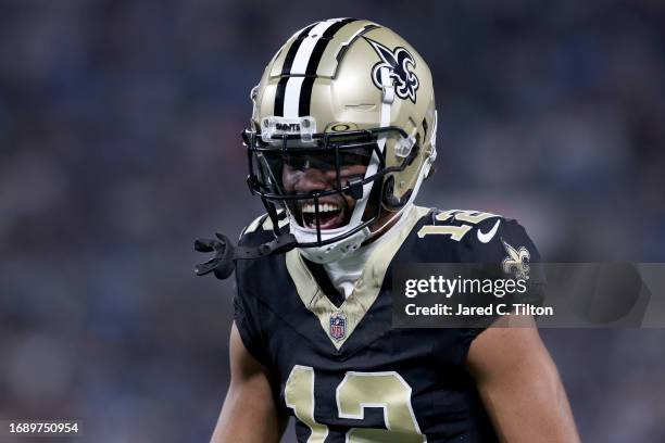 Chris Olave of the New Orleans Saints celebrates after catching a 42 yard pass against CJ Henderson of the Carolina Panthers during the third quarter...