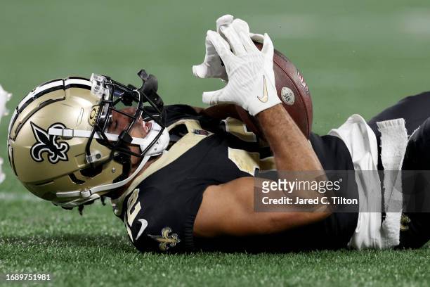 Chris Olave of the New Orleans Saints catches a 42 yard pass against CJ Henderson of the Carolina Panthers during the third quarter in the game at...