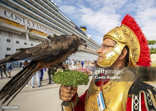 Tourist group of the Costa Favolosa cruise ship carrying 2350 passengers with the length of 290 meter is welcomed by a folk dance team at Halku'l...