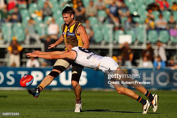 Brent Guerra of the Hawks kicks under pressure during the round eight AFL match between the Hawthorn Hawks and the Greater Western Sydney Giants at...