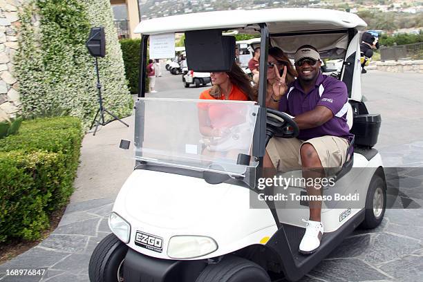 Linebacker Kirk Morrison, Actress Jasmine Dustin and guest attend the 2nd annual Hank Baskett Classic Golf Tournament held at the Trump National Golf...