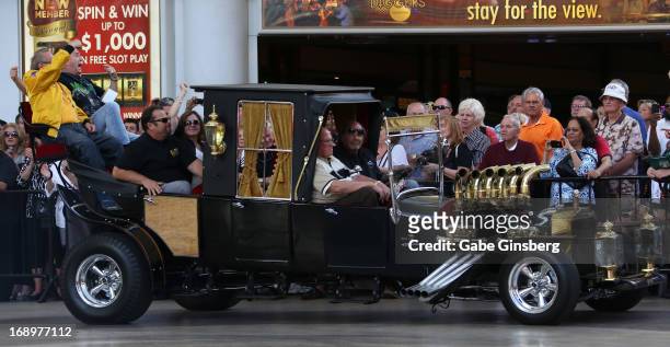 Car designer George Barris and actor Butch Patrick arrive in the Munster Koach from the television series "The Munsters" at the opening ceremony of...
