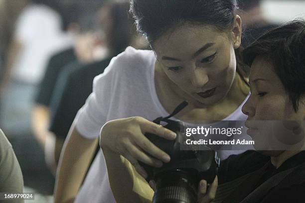 Model prepares backstage ahead of the Audi Star Creation Capsule Showcase on May 17, 2013 in Singapore.