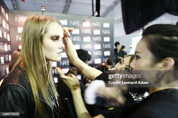 Model prepares backstage ahead of the Audi Star Creation Capsule Showcase on May 17, 2013 in Singapore.