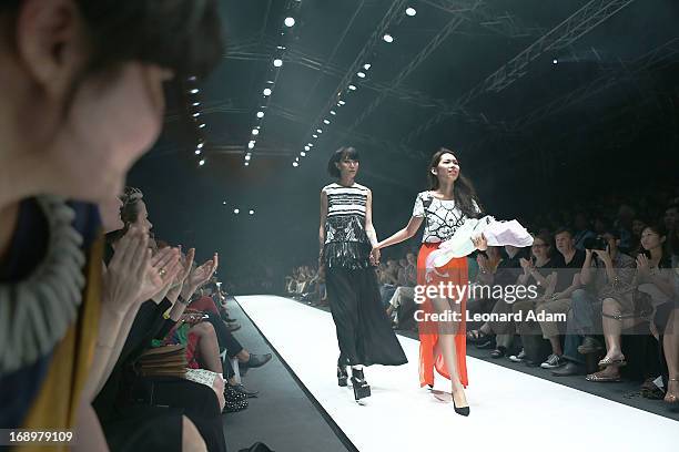 Designer Soravit Kaewkamon of Thailand walks the runway during the Audi Star Creation Capsule Showcase on May 17, 2013 in Singapore.