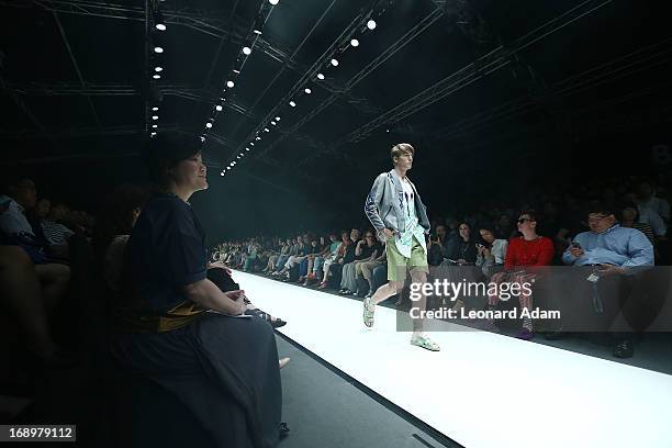 Model showcases designs by Soravit Kaewkamon of Thailand during the Audi Star Creation Capsule Showcase on May 17, 2013 in Singapore.