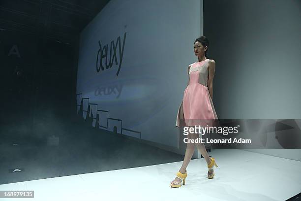 Model showcases designs by Ko Youngji of South Korea during the Audi Star Creation Capsule Showcase on May 17, 2013 in Singapore.