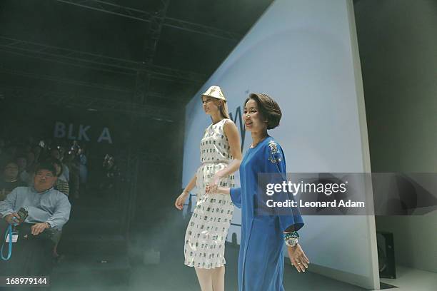 Designer Ko Youngji walks the runway during the Ko Youngji show during the Audi Star Creation Capsule Showcase on May 17, 2013 in Singapore.