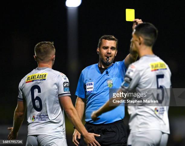 Dublin , Ireland - 25 September 2023; Referee Robert Harvey shows Shane Griffin of Shelbourne a yellow card during the SSE Airtricity Men's Premier...