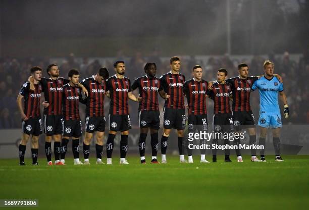 Dublin , Ireland - 25 September 2023; Bohemians players stand for a moments silence before the SSE Airtricity Men's Premier Division match between...