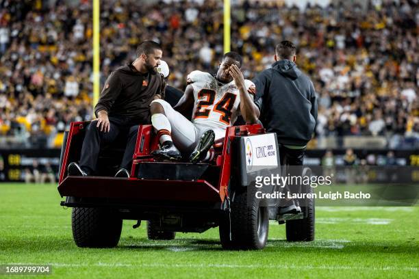 Nick Chubb of the Cleveland Browns is carted off of the field after hurting his knee during the second quarter of the game against the Pittsburgh...