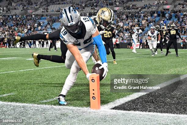 Adam Thielen of the Carolina Panthers scores a touchdown against Alontae Taylor of the New Orleans Saints during the fourth quarter in the game at...