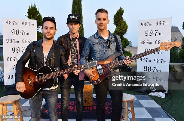 Musicians Michael Bruno, Alexander Noyes and Andrew Lee Schmidt of the band Honor Society pose before performing onstage at the OvertureCon launch...