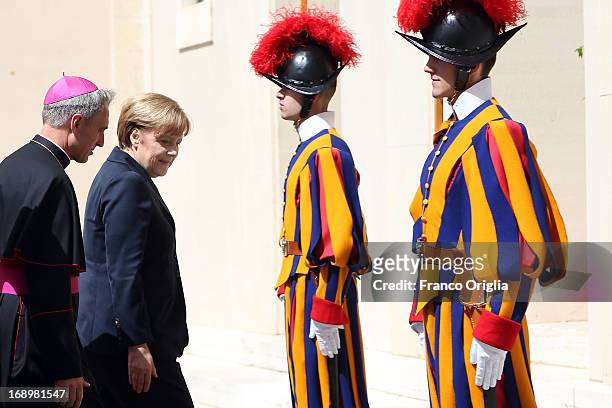 Chancellor of Germany Angela Merkel is received by Prefect of the Pontifical House and former personal secretary of Pope Benedict XVI Georg Ganswein...