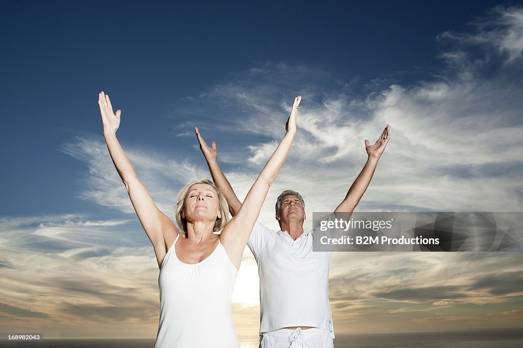 Senior Couple With Hand Raised