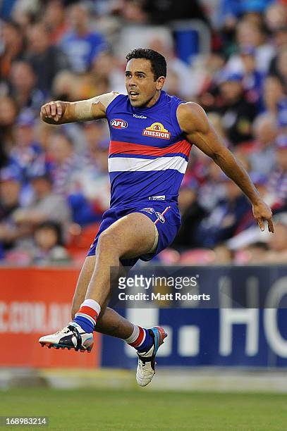 Brett Goodes of the Bulldogs kicks during the round eight AFL match between the Gold Coast Suns and the Western Bulldogs at Metricon Stadium on May...
