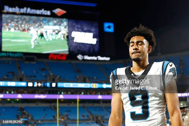 Bryce Young of the Carolina Panthers walks off the field after being defeated by the New Orleans Saints in the game at Bank of America Stadium on...