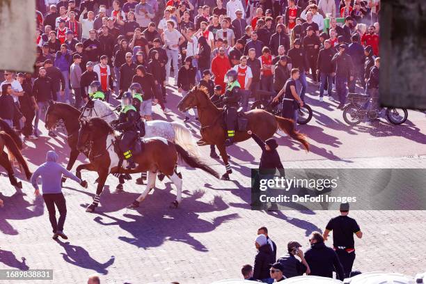 Riots outside the Ajax stadium during the Dutch Eredivisie match between AFC Ajax and Feyenoord at Johan Cruijff Arena on September 24, 2023 in...