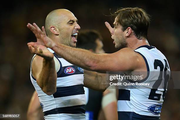 James Podsiadly of the Cats is congratulated by Tom Hawkins after kicking a goal during the round eight AFL match between the Collingwood Magpies and...