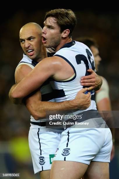 James Podsiadly of the Cats is congratulated by Tom Hawkins after kicking a goal during the round eight AFL match between the Collingwood Magpies and...