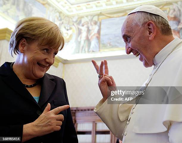 Pope Francis meets with German Chancellor Angela Merkel during a private audience at the Vatican on May 18, 2013. AFP PHOTO/POOL/Gregorio Borgia