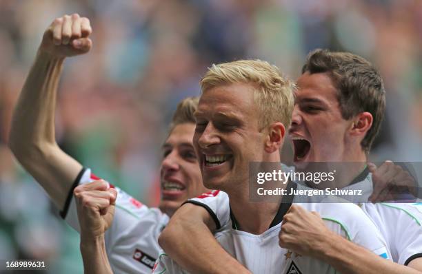 Patrick Herrmann, Mike Hanke and Branimir Hrgota of Moenchengladbach celebrate during the Bundesliga match between Borussia Moenchengladbach and...