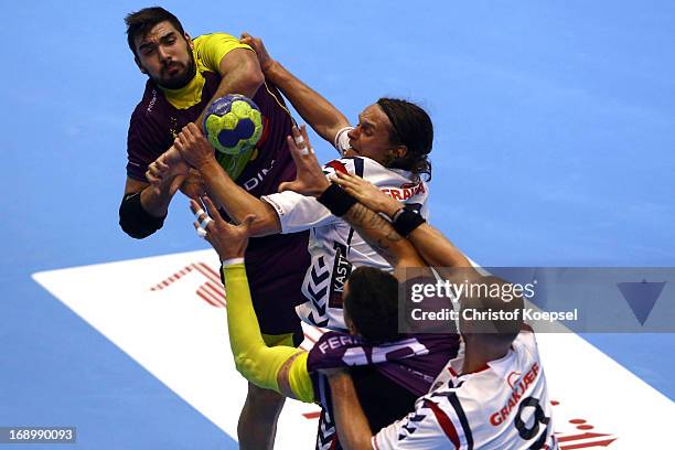 Jakob Thoustrup of Holstebro and Soeren Soerensen of Holstebro defend against Jorge Maqueda Pena of Nantes during the EHF Cup Semi Final match...