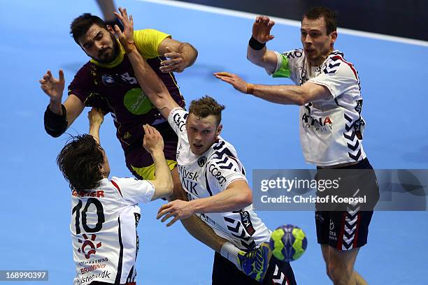 Magnus Bramming of Holstebro , jakob Green of Holstebro and Mads Christiansen of Holstebro defend against Jorge Maqueda Pena of Nantes during the EHF...