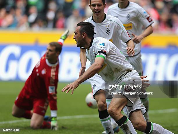 Martin Stranzl of Moenchengladbach celebrates after scoring the opening goal against Manuel Neuer of Munich during the Bundesliga match between...