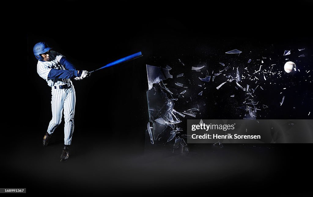 Baseball player shooting through glass