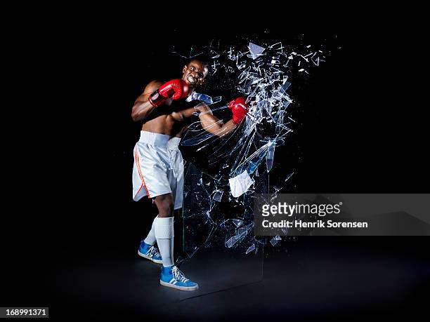 boxer shattering barrier - breaking boundaries stock pictures, royalty-free photos & images