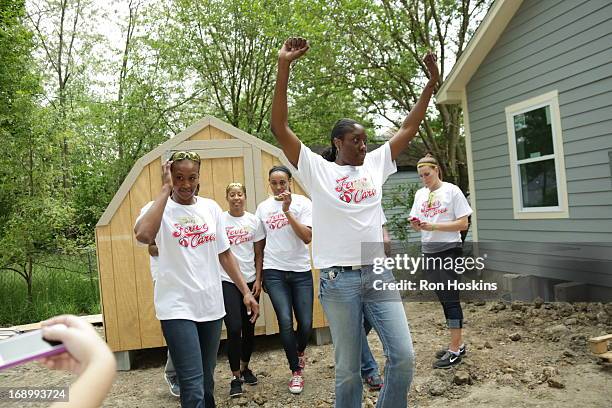 Jessica Davenport of the Indiana Fever celebrates as the Fever participated in a Habitat for Humanity build on May 17, 2013 in Indianapolis, Indiana....