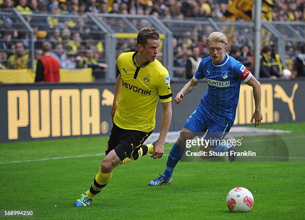 Lukasz Piszczek of Dortmund is challenged by Andreas Beck of Hoffenheim during the Bundesliga match between Borussia Dortmund and TSG 1899 Hoffenheim...