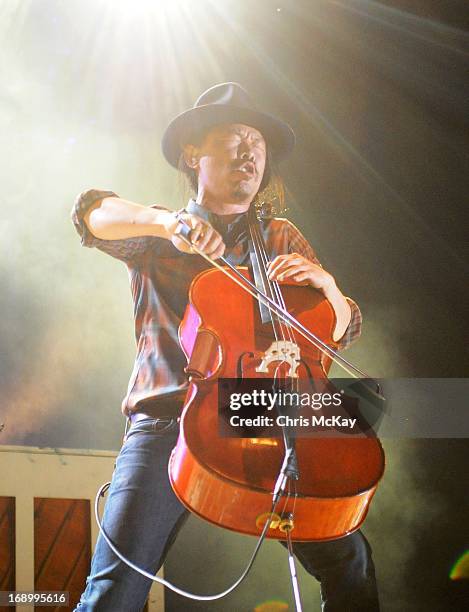 Joe Kwon of Avett Brothers performs at Verizon Wireless Amphitheater on May 17, 2013 in Alpharetta, Georgia.