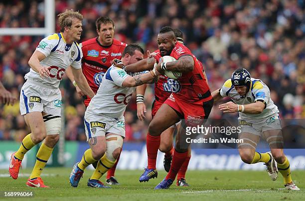 Mathieu Bastareaud of Toulon is tackled by the Clermont defence during the Heineken Cup final match between Clermont Auvergne and RC Toulon at the...