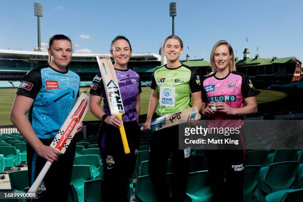 Tahlia McGrath of the Strikers, Heather Graham of the Hurricanes, Phoebe Litchfield of the Thunder and Ellyse Perry of the Sixers pose at Sydney...